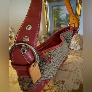 Coach red leather accent handbag.